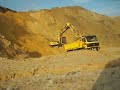 Loading some truck with Kobelco SK 200 Marke III
