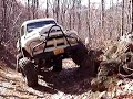 1951 Ford truck flexing on a rock 1951 Ford truck flexing on a rock