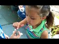Kash and Kennedy playing with a Lizard!