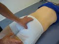 Skolerne for Idr�tsmassage -- palpation of sacrotuberal lig.
