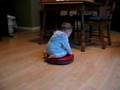 Baby is riding the Roomba