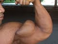 Bodybuilder Ko Chandetka poses peaked biceps