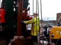 Water well drilling casing driving in artesian borehole.
