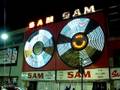 Historic Sam the Record Man sign lights for the last time.