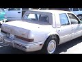 This is a stylish 4 door sedan with an original Sandstone Metallic paint. It features a very stylish Carriage Roof Top and Factory Chrome 15