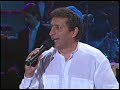 Pini Cohen Sings \"Shebechi\" on the Chabad Telethon