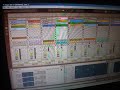 video showing how the screen in ableton live 7 acts while being controlled by a $30.00 logitech pc gamers' joystick. the buttons on the side of the thing toggle each of the eight tracks' effects on and off as well. the tracks on the five bottom rows coloured white are full-length tracks. some are original grooves and others are by other artists. the coloured clips are all 