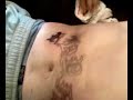 lol its me avin ma tattoo dun on ma stomach an yes it fukin killed lyk a cunt