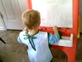 Lucas painting his easel 1-30-08
