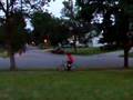Kid on bike getting hit in head with basketball