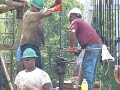Workover Rig Running New Rods Into Oil Well