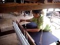 une femme m'accueille dans sa maison et m'explique le tissage de la soie

a woman welcomes me in her house and explains how making silk materials by showing