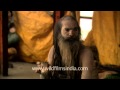 Indian holy man Naga Baba sit inside the tent on ...