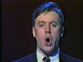 A younger Anthony Warlow sings \"Music of the Night\"