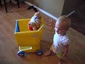 playing with grocery cart and dancing
