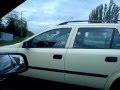 Bird fights itself in car mirror