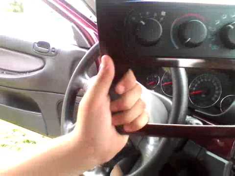 How to dismantle the radio console on a Chrysler s