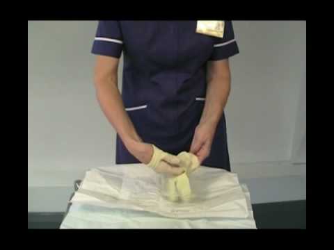 Putting on sterile gloves