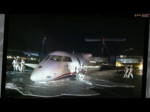 AT - Pilot forced to land plane without the use of landing gear.