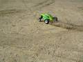 E-Maxx throwing sand