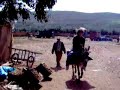 Mehdi rides a donkey