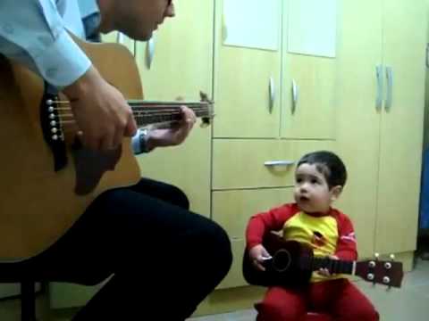 Baby And Dad Playing 
