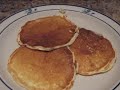 here is my breakfast low carb cooking video where i make my favorite low carb pancake recipe.  this isn't induction friendly due to the baking mix, but you could substitute some almond flour to make it induction legal.  here's the recipe:
* 8oz pkg cream cheese
* 3 eggs
* 3 tsp splenda or equivalent liquid splenda
* 1/4 cup atkins bake mix *recipe below
* 1/2 tsp baking powder
* 1/2 tsp vanilla
* 1/4 cup heavy cream or buttermilk 

beat cream cheese with mixer until blended smooth.  add the remaining ingredients, and let sit for 5 minutes.   preheat non-stick pan to med/high heat.   spray pan with non stick spray and use 1/4 cup measure per pancake.   yield 10 pancakes.

nutrition info:
total calories 107, fat: 10g, carbs: 1.7g, protein: 4g