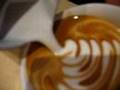 latte art - rosetta with heart on top