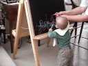Ben draws on blackboard