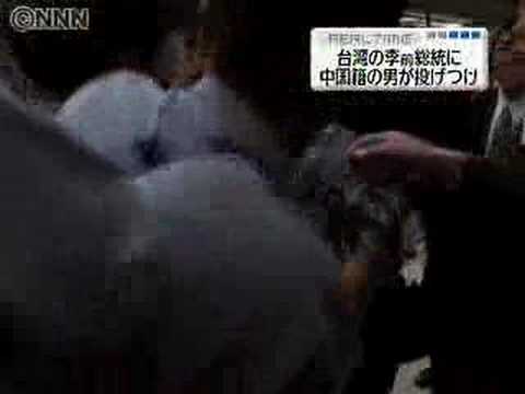 A Chinese man throws bottles at ...