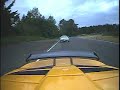 Mercedes SLK and Lotus at the racetrack