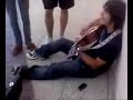 Tony playing guitar at the avenues