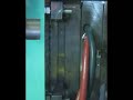Yushin robot on injection molding press