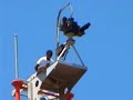 Tito Kayak scales Israeli surveillance tower in Bil'in