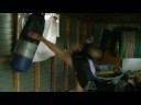 Axeman kickboxing the bag. Axeman kickboxing the bag.