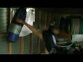 Axeman kickboxing the bag.