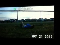 Kid falls on his face after jumping over fence