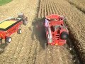 harvesting corn in iowa. this video was taken about 30 feet above the combine. it's an unusual camera angle.