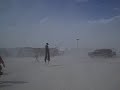 Dancing Preacher on stilts in a Sandstorm Dancing Preacher on stilts in a Sandstorm