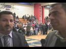 Iraqis watch the caucus process