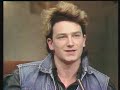 Follow us on Facebook: www.facebook.com Bono, lead singer of U2, talks to Gay Byrne about making of the video of 'New Year's Day, playing the Dandelion market and why he thinks drugs are boring. He also introduces his wife Ali. © Belongs to www.rte.ie Follow us here www.facebook.com www.facebook.com Thanks 4 Watching