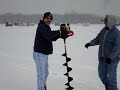 Beav drilling a hole in the ice/lake