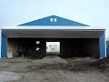 Post frame building: airplane hangar bi-fold door