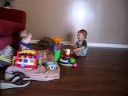 george lovin preston's toys, and preston having fun just watching.