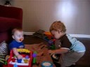 george lovin preston's toys, and preston having fun just watching.