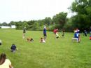 Coaches and players teaching the youth fundimentals.