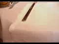 waiter cutting and serving cheese at the renowned alaine ducasse restaurant in paris.