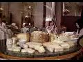 waiter cutting and serving cheese at the renowned alaine ducasse restaurant in paris.