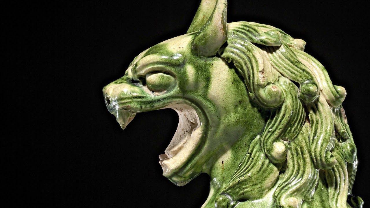 Earthenware Tomb Figure of a roaring Lion with green Splash-glaze