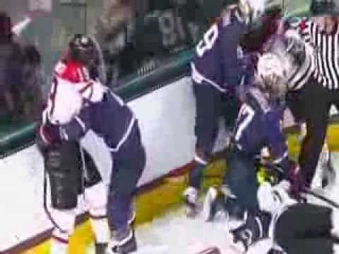 Canada's Brianne Jenner check on USA's Josephine Pucci; Donnybrook at the end of the game